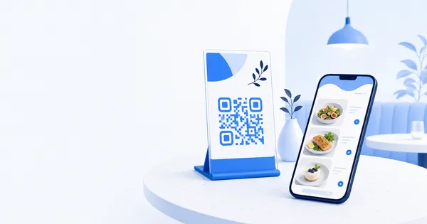 A branded QR menu stand on a cafe table next to a phone showing a styled digital menu